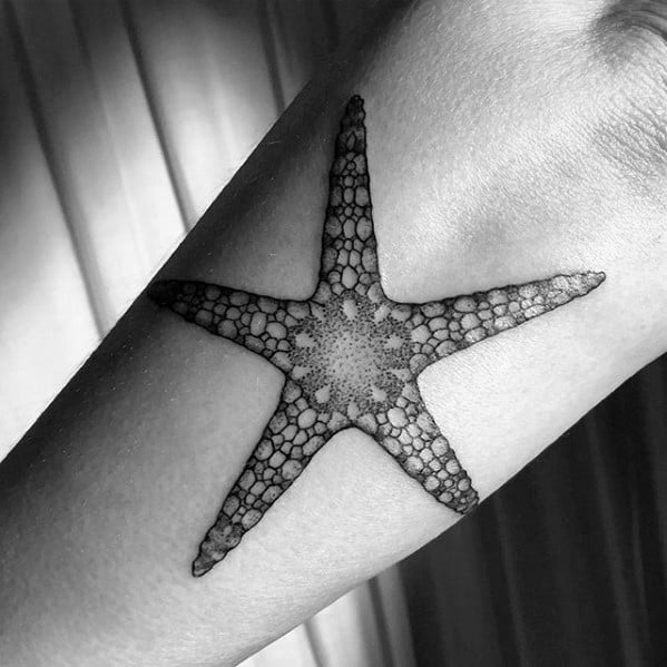 guy-with-starfish-tattoo-design-on-arm