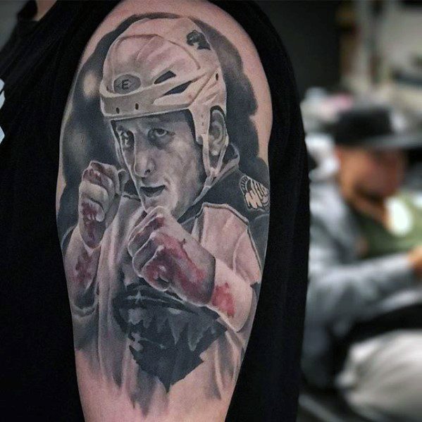 guy-with-hockey-sports-tattoo-design