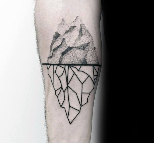 Iceberg tattoo on the left inner forearm