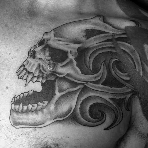 gentleman-with-chest-tribal-skull-tattoo