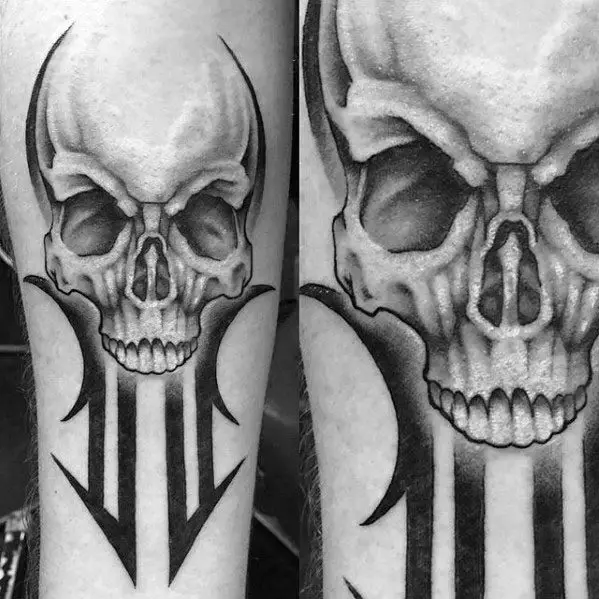 guy-with-tribal-skull-tattoo-design