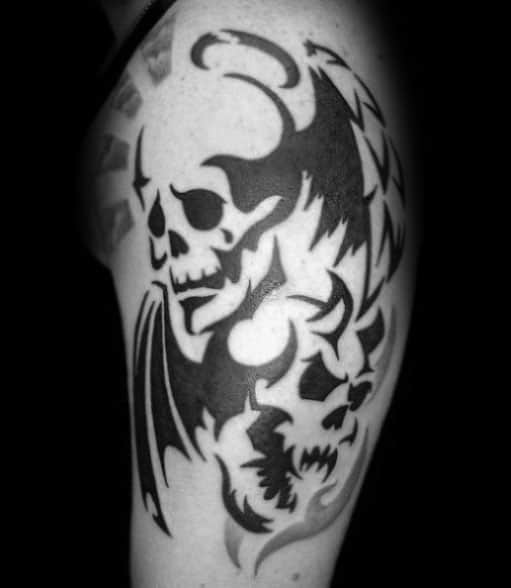 guys-arm-tattoos-with-tribal-skull-design