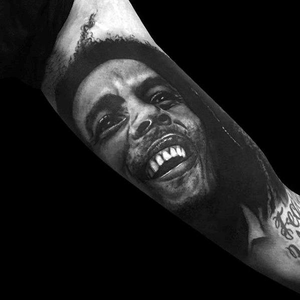 mens-portrait-of-bob-marley-inner-arm-bicep-tattoo