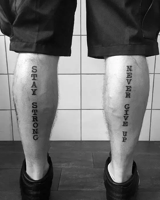 guy-with-never-give-up-tattoo-design-on-back-of-legs