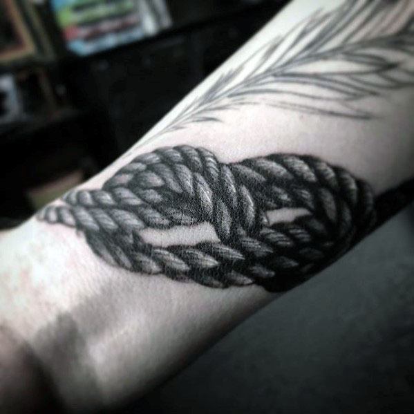 guy-with-rock-climbing-rope-wrist-tattoo-design