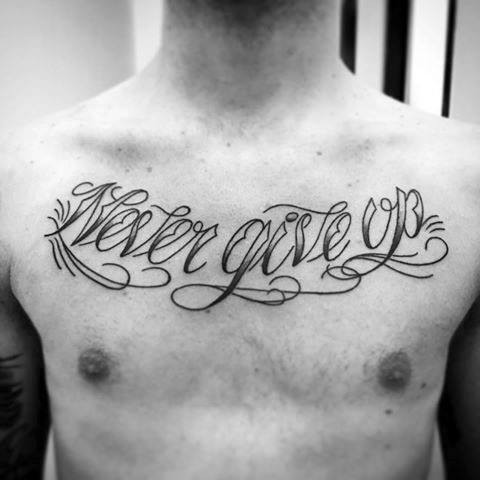 masculine-never-give-up-tattoos-for-men-on-upper-chest