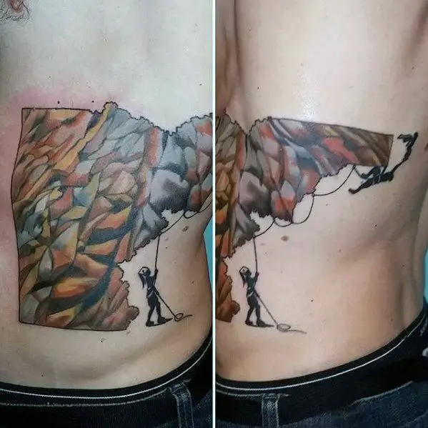 rock-climbing-tattoo-design-on-man-on-ribs