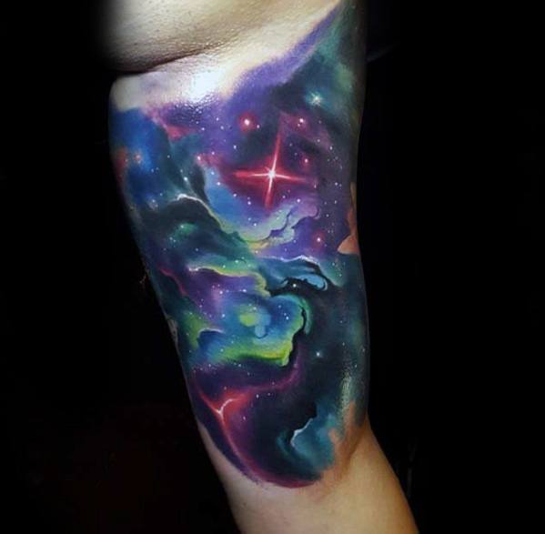 male-inner-arm-bicep-watercolor-tattoo-with-celestial-design