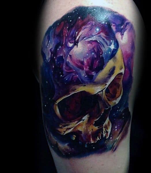 mens-tattoo-with-skull-stars-in-sky-celestial-design-on-thigh