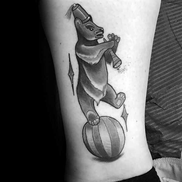 creative-circus-bear-on-ball-tattoos-for-men-on-lower-leg