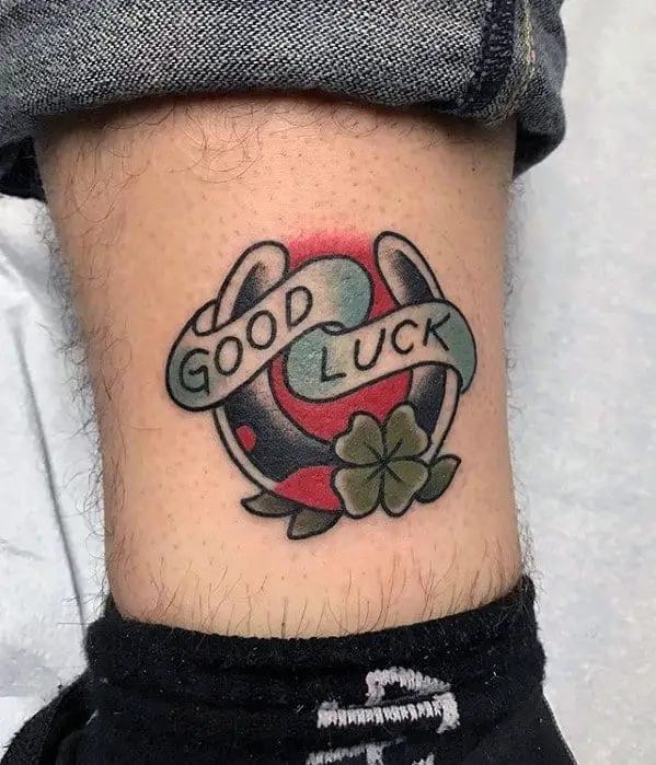 lower-leg-horseshoe-banner-mens-good-luck-tattoo-ideas