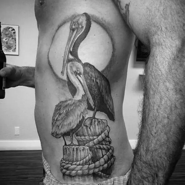 masculine-pelican-tattoos-for-men-on-rib-cage-side