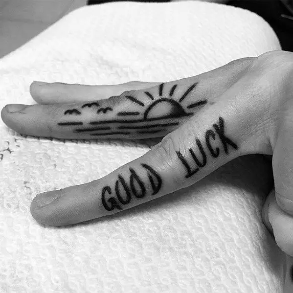 side-of-fingers-mens-cool-good-luck-tattoo-ideas