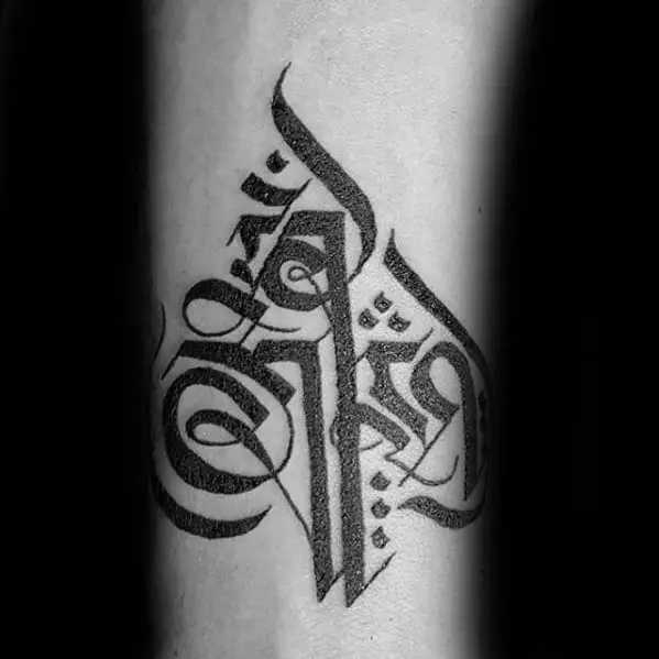 guy-with-sanskrit-tattoo-design-on-inner-forearm-with-black-ink