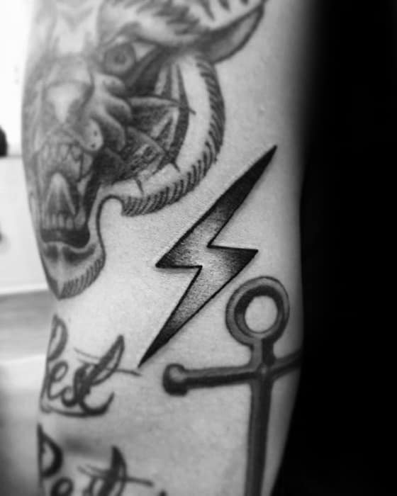 guys-filler-shaded-lighting-bolt-arm-tattoo-deisgns