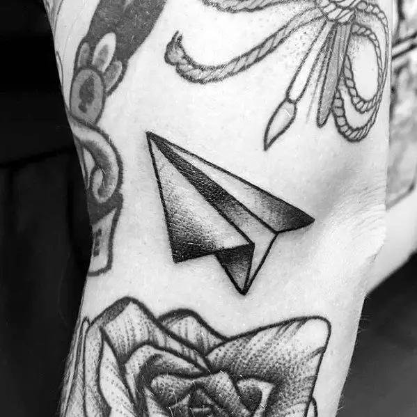 leg-paper-airplane-black-and-grey-ink-filler-tattoos-male