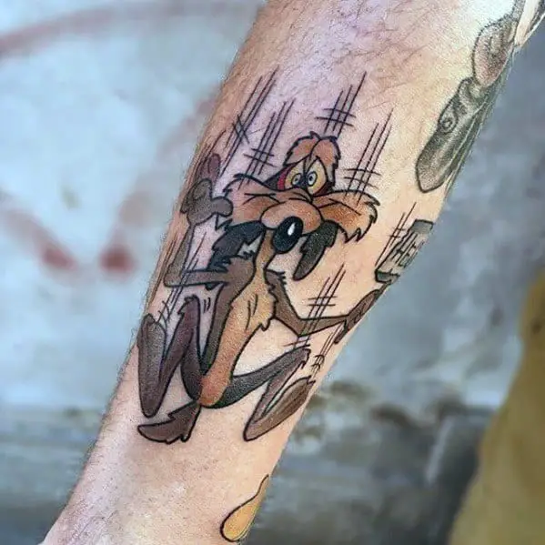 male-cool-looney-tunes-tattoo-ideas-wile-e-coyote-falling-down-on-inner-forearm