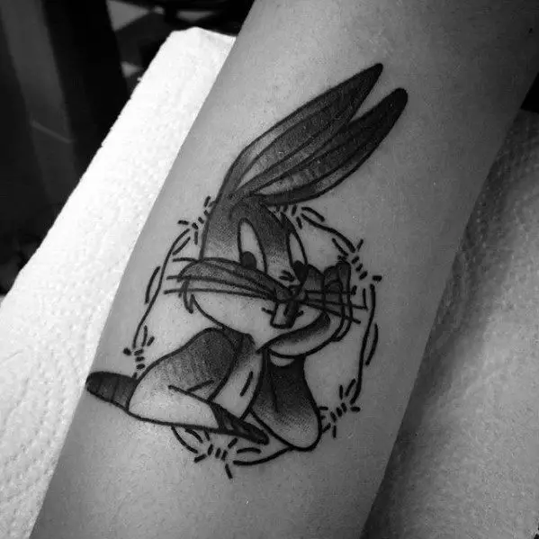 male-tattoo-with-looney-tunes-design-small-bugs-bunny-forearm