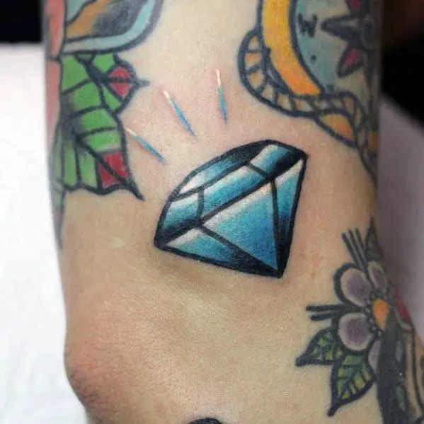 small-outer-arm-traditional-diamond-filler-guys-tattoo