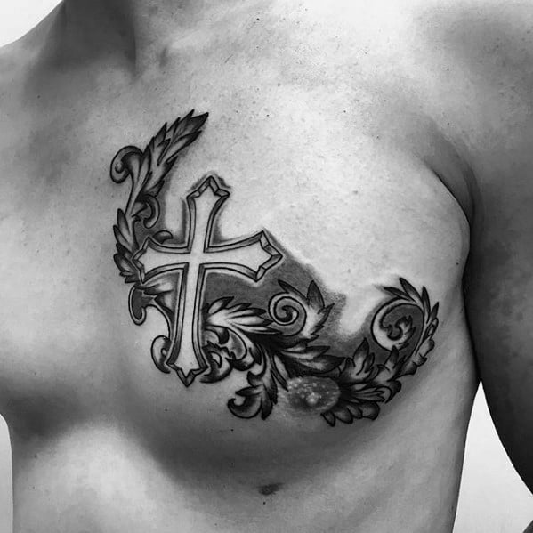 ornate-small-religious-male-cross-upper-chest-tattoo