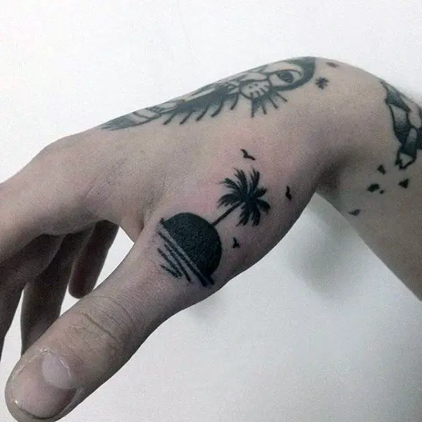 island-with-palm-tree-small-beach-mens-hand-tattoo