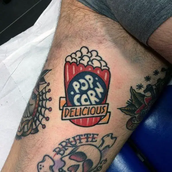 guys-old-school-small-colorful-popcorn-thigh-tattoo