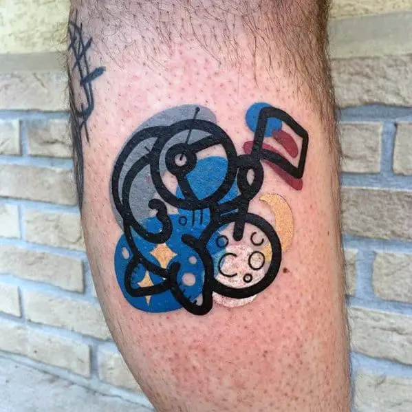small-colorful-astronaut-with-moon-guys-leg-tattoo