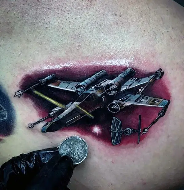 small-colorful-realistic-star-wars-space-ship-mens-chest-tattoo