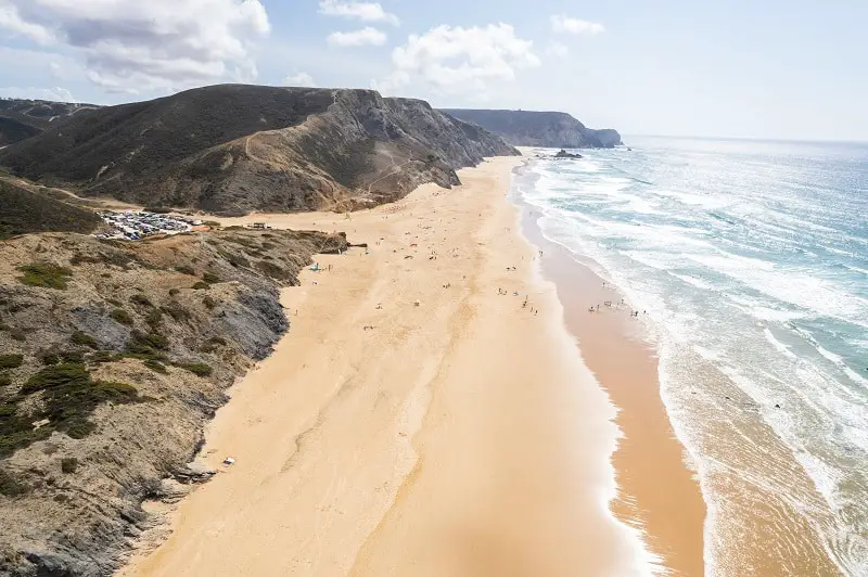 Cordoama beach in Portugal. Aerial drone view of waves, sandy be