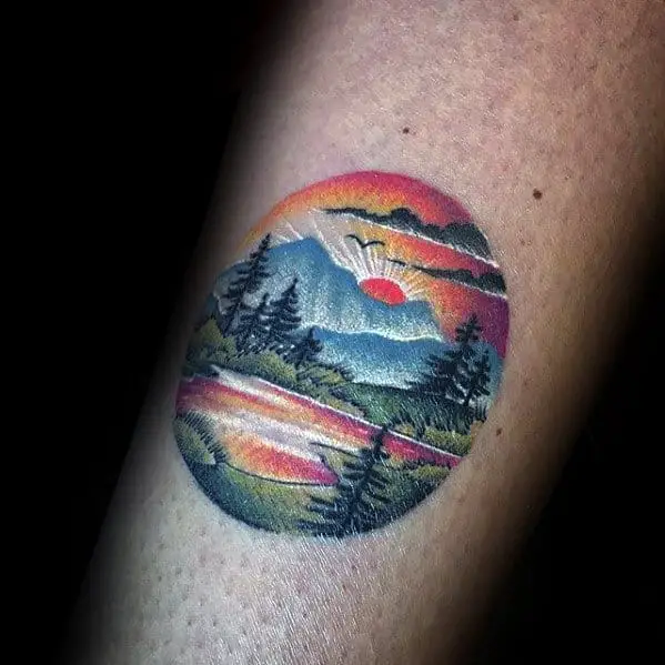 cool-colorful-mens-detailed-small-nature-mountains-tattoo-on-arm