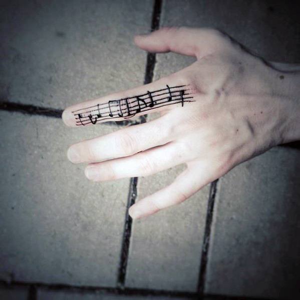 mens-music-sheet-simple-finger-tattoo-designs