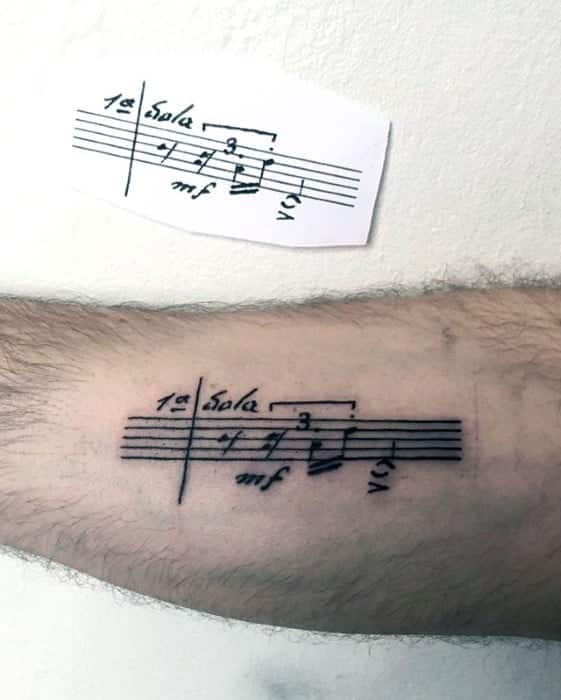 mens-simple-music-sheet-inner-arm-tattoo