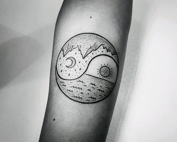 sun-and-moon-with-beach-and-mountains-small-nature-mens-yin-yang-arm-tattoo