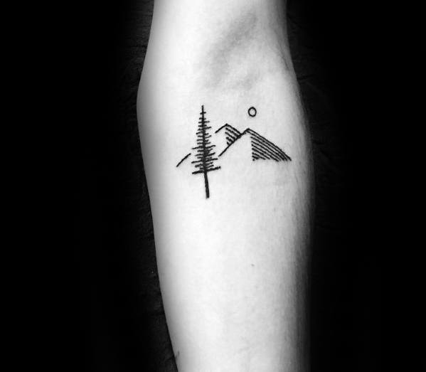 tree-with-mountains-small-sketched-mens-inner-forearm-tattoo