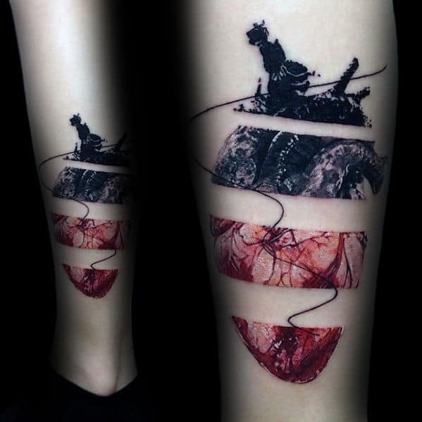 artistic-mens-negative-space-realistic-heart-tattoo-on-leg