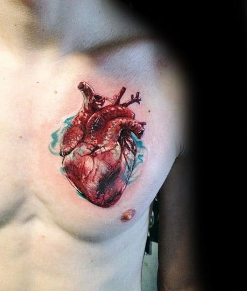 guys-realistic-heart-with-blue-ink-watercolor-design-chest-tattoo