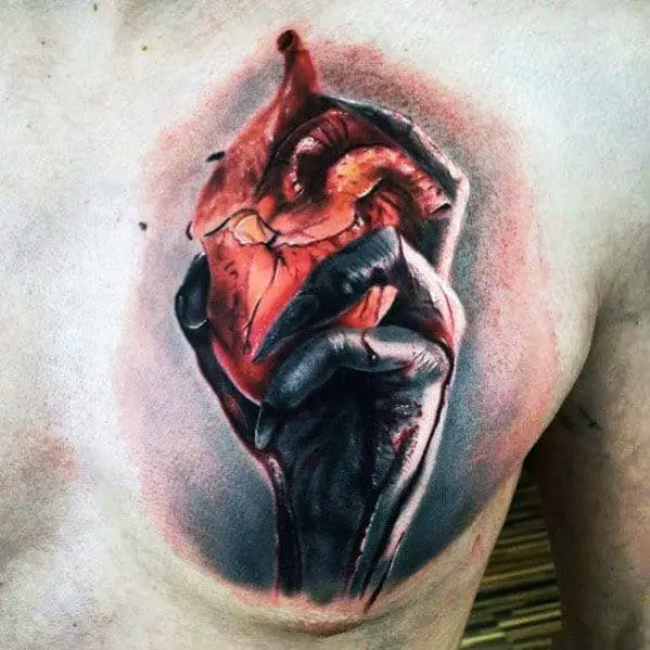 hand-holding-heart-guys-realistic-upper-chest-tattoo