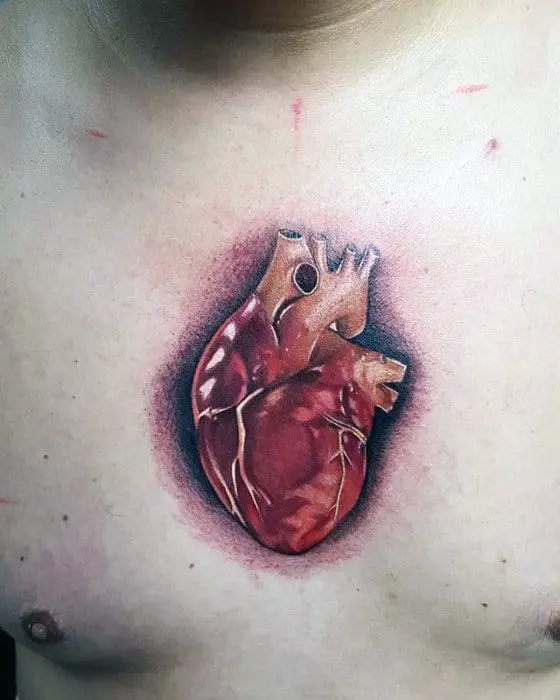 small-mens-anatomical-heart-center-of-chest-tattoo-designs